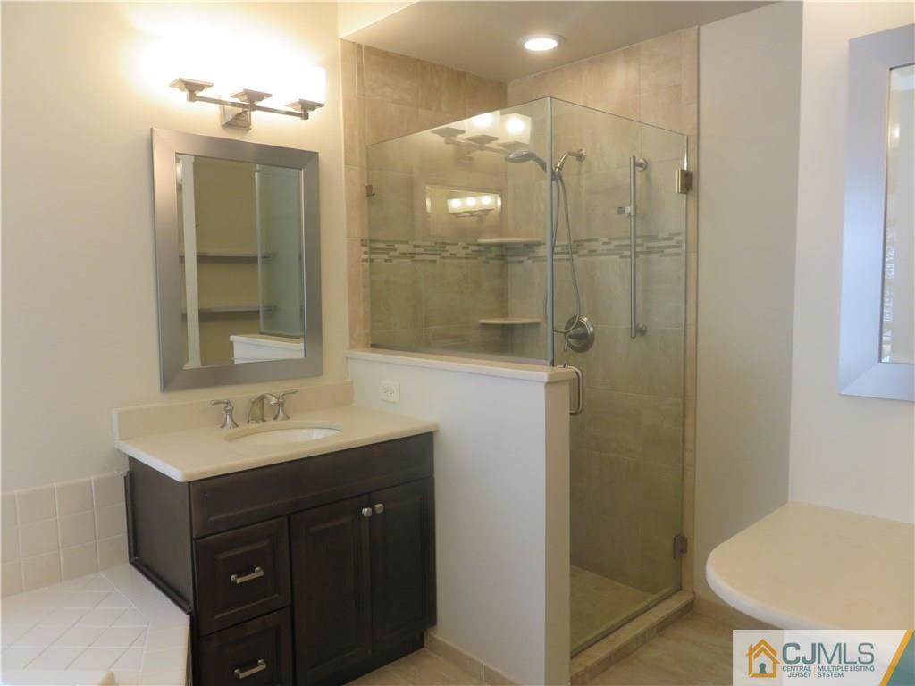 55 Primrose Circle Princeton, NJ 08540 - Photo 12 of 24 a bathroom with a sink a toilet and shower