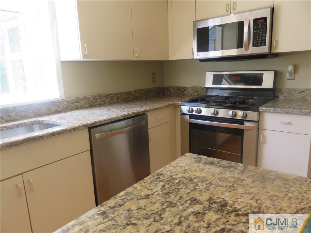 55 Primrose Circle Princeton, NJ 08540 - Photo 7 of 24 a kitchen with a stove and a sink