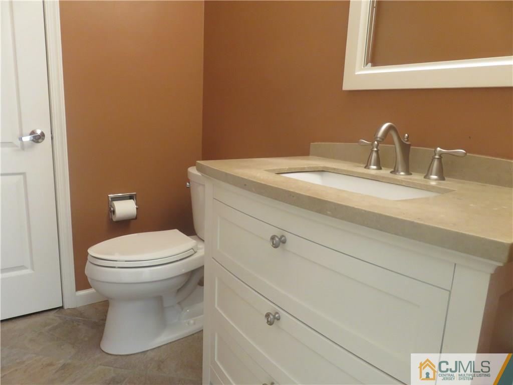 55 Primrose Circle Princeton, NJ 08540 - Photo 10 of 24 a bathroom with a toilet sink and mirror