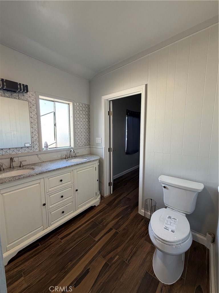 2521 P Bakersfield, CA 93301 - Photo 13 of 21 a bathroom with a toilet sink and mirror