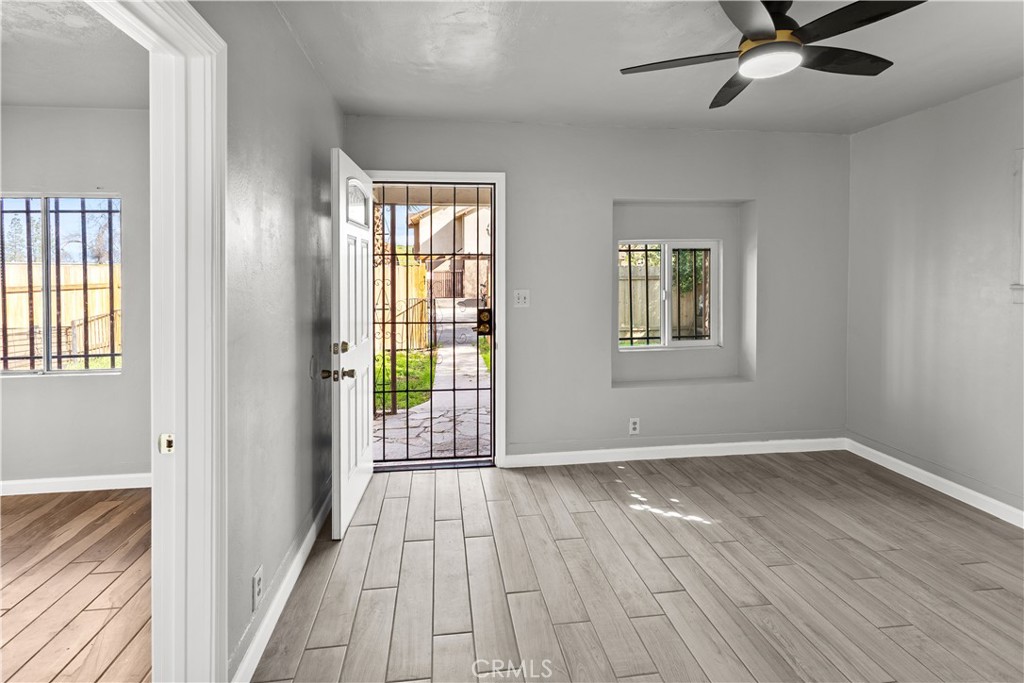 2521 P Bakersfield, CA 93301 - Photo 4 of 21 a view of an empty room with wooden floor and a window