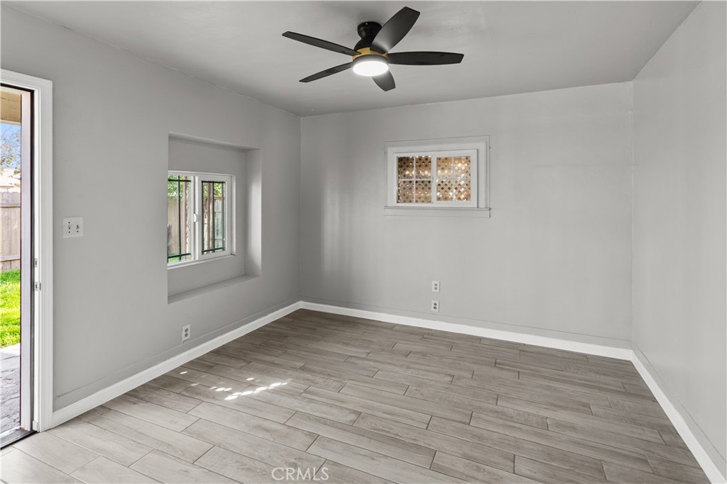 2521 P Bakersfield, CA 93301 - Photo 5 of 21 a view of empty room with wooden floor and fan