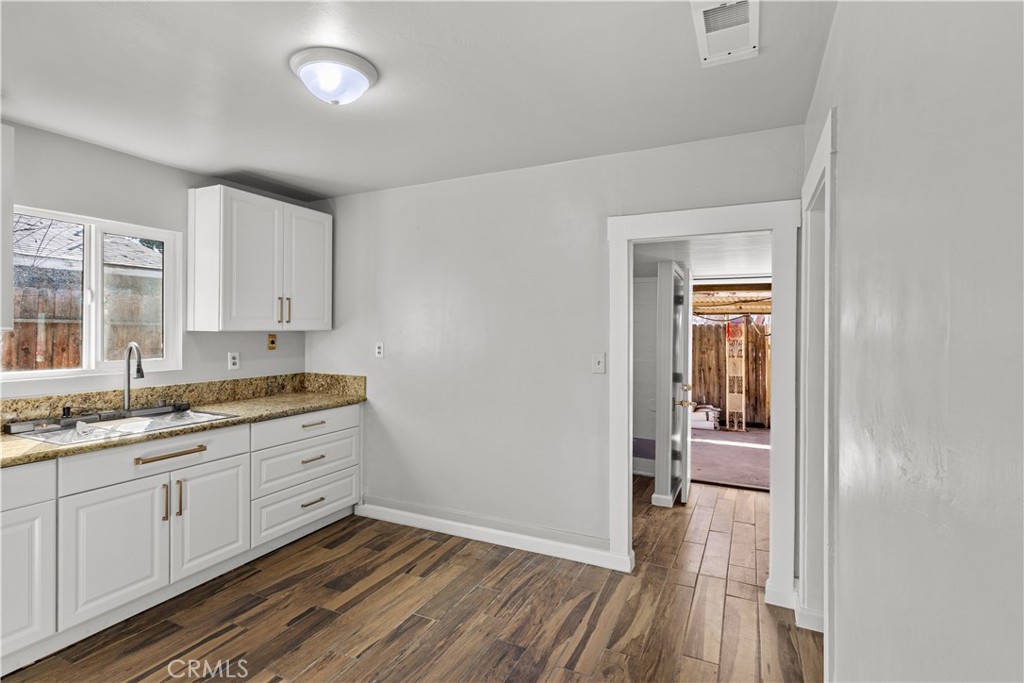 2521 P Bakersfield, CA 93301 - Photo 7 of 21 a room with a sink and a mirror