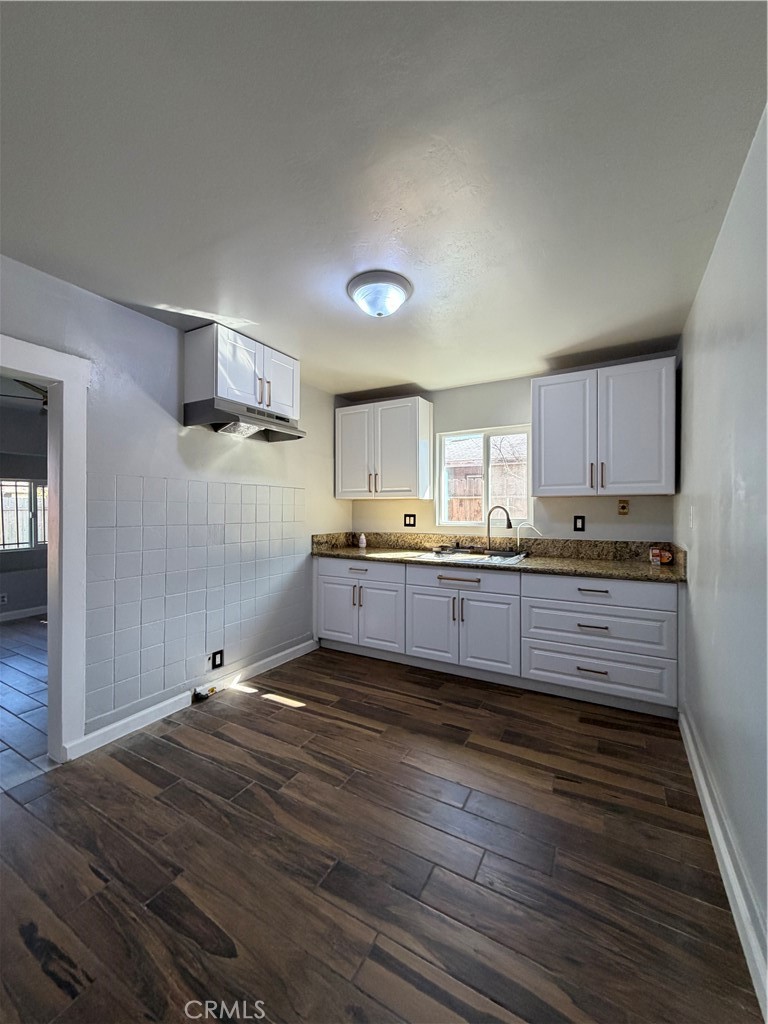 2521 P Bakersfield, CA 93301 - Photo 9 of 21 a kitchen with stainless steel appliances kitchen island wooden cabinets and granite counter tops