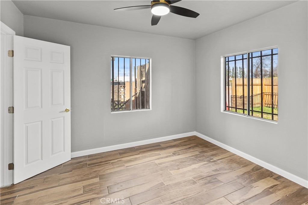 2521 P Bakersfield, CA 93301 - Photo 10 of 21 a view of empty room with wooden floor and fan