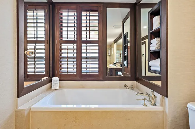 a bathroom with a granite countertop sink mirror and double