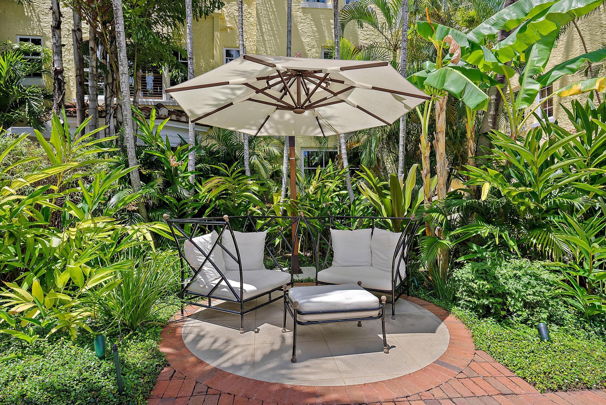 301 Australian Avenue, Unit 301 Palm Beach, FL 33480 - Photo 20 of 26 a view of a patio with furniture