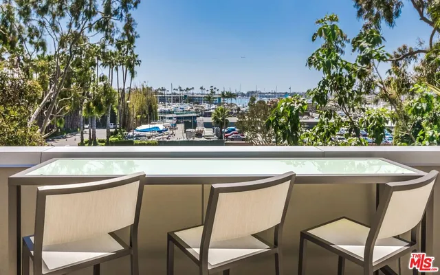 a view of a swimming pool with a patio and a yard