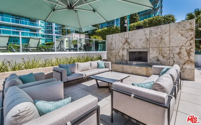 a view of a swimming pool with a patio