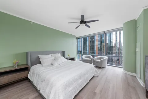 a bedroom with a large bed and a window