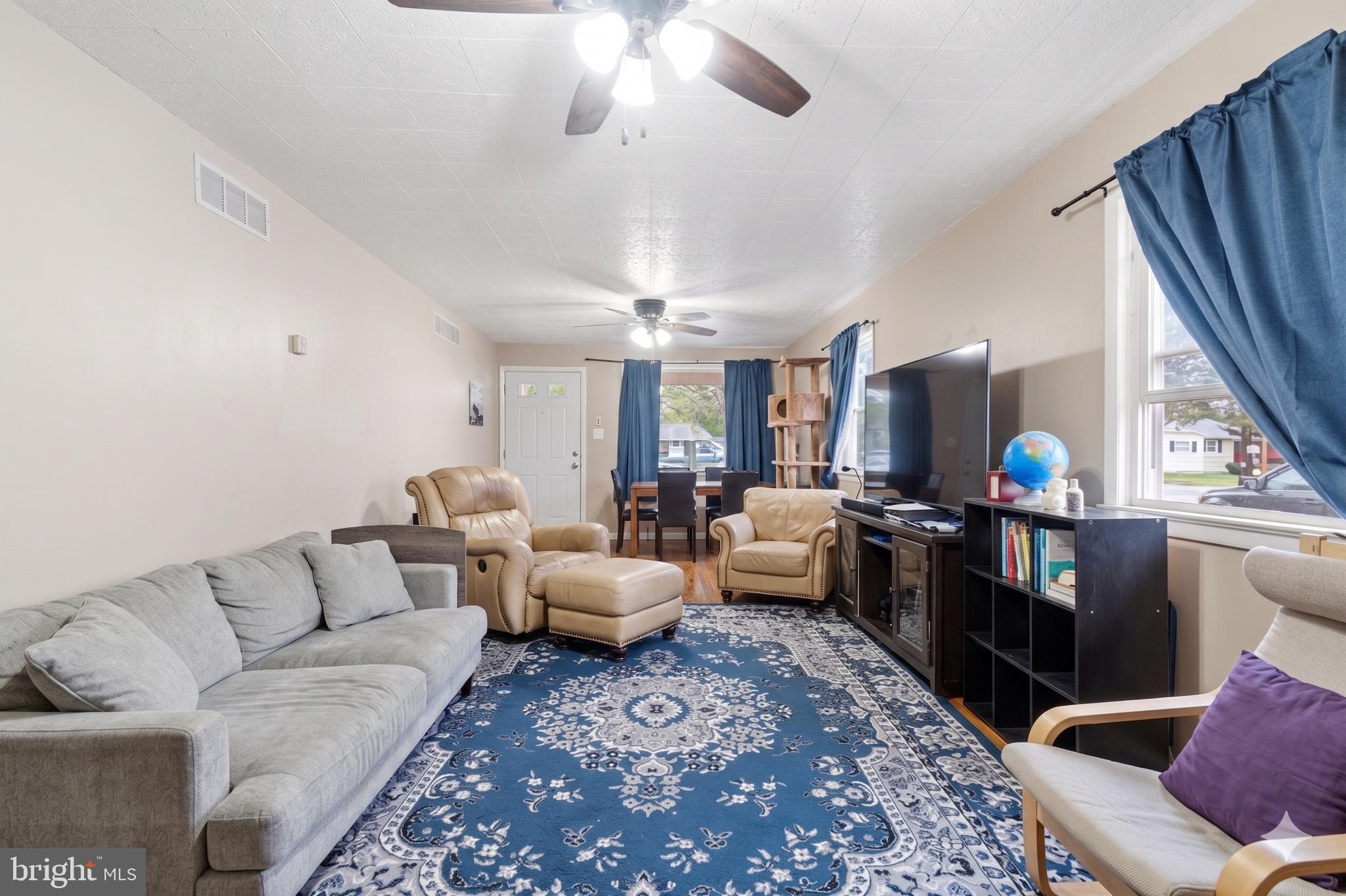 16700 Frederick Road Mount Airy, MD 21771 - Photo 20 of 45 a living room with furniture and a flat screen tv