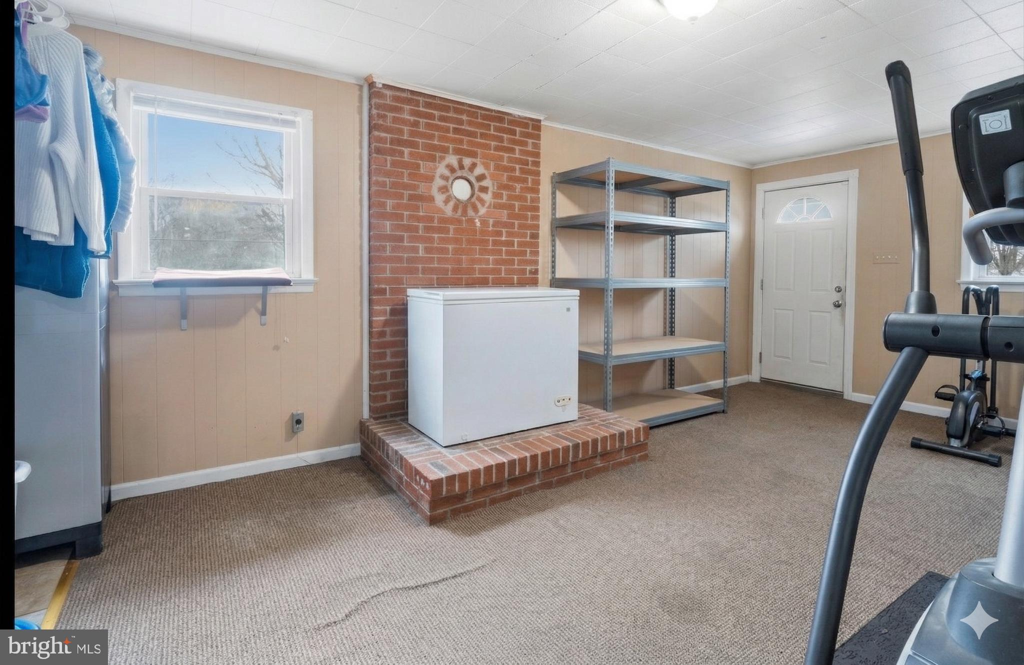 16700 Frederick Road Mount Airy, MD 21771 - Photo 22 of 45 a room with a chair and gym equipment