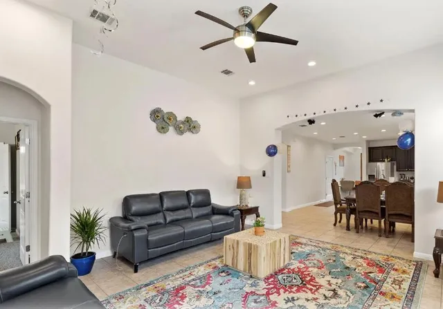 a view of a dining room with furniture and a large window