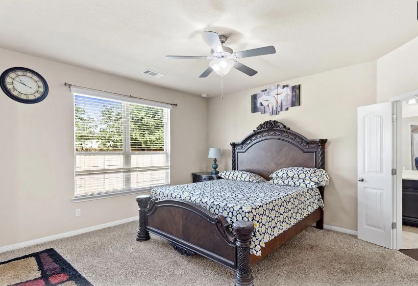 2781 Santa Ana Lane Round Rock, TX 78665 - Photo 10 of 22 a bedroom with a bed and window