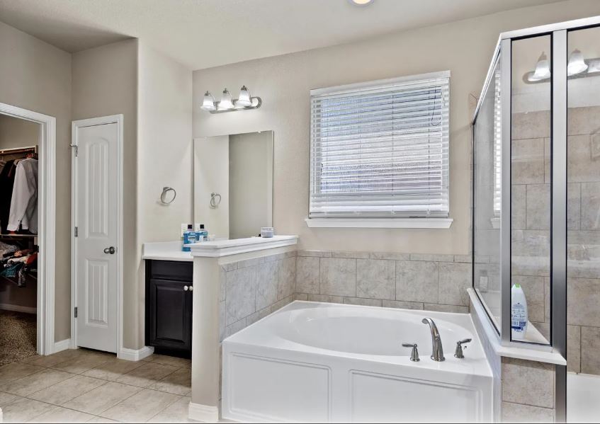 2781 Santa Ana Lane Round Rock, TX 78665 - Photo 15 of 22 a bathroom with a bathtub and a sink