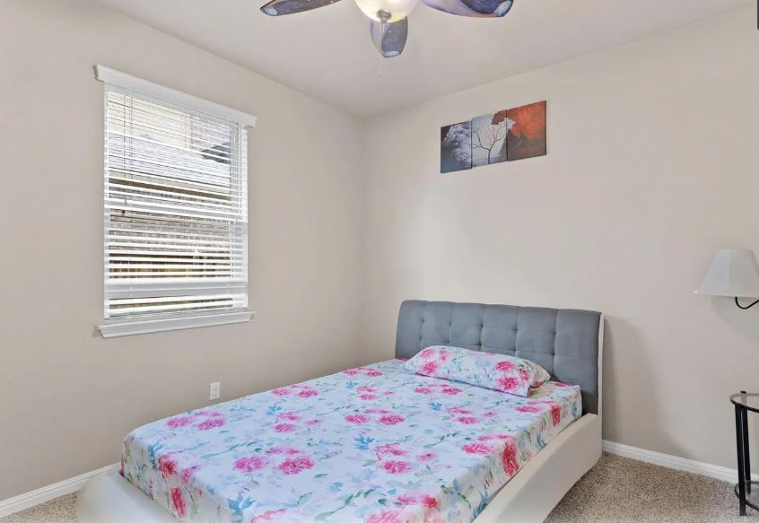 2781 Santa Ana Lane Round Rock, TX 78665 - Photo 17 of 22 a bedroom with a bed and a window