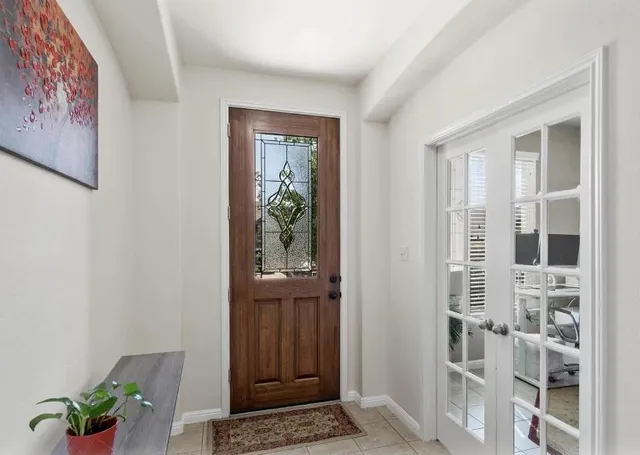 a view of front door with wooden floor