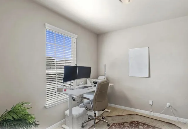 a view of a workspace with furniture