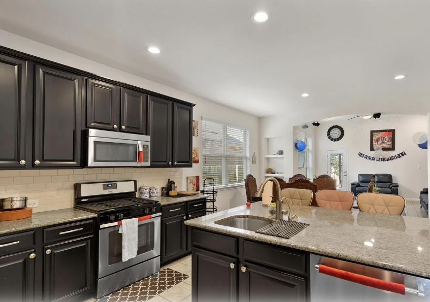 2781 Santa Ana Lane Round Rock, TX 78665 - Photo 22 of 22 a kitchen with kitchen island granite countertop a sink counter top space appliances and cabinets