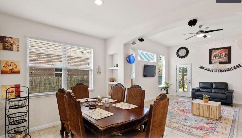 2781 Santa Ana Lane Round Rock, TX 78665 - Photo 7 of 22 a view of a dining room with furniture and a large window