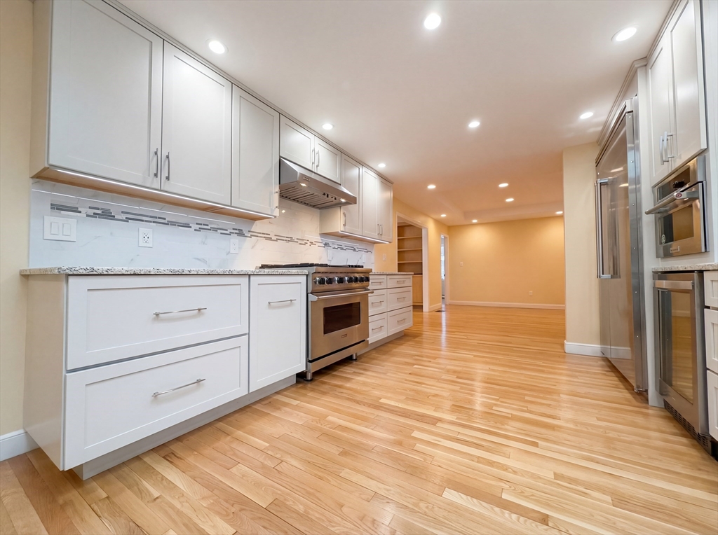 16 Crest Drive Dover, MA 02030 - Photo 11 of 24 a kitchen with stainless steel appliances granite countertop a stove and a sink