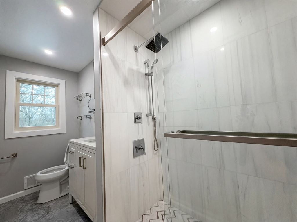 16 Crest Drive Dover, MA 02030 - Photo 15 of 24 a bathroom with a granite countertop shower and a toilet