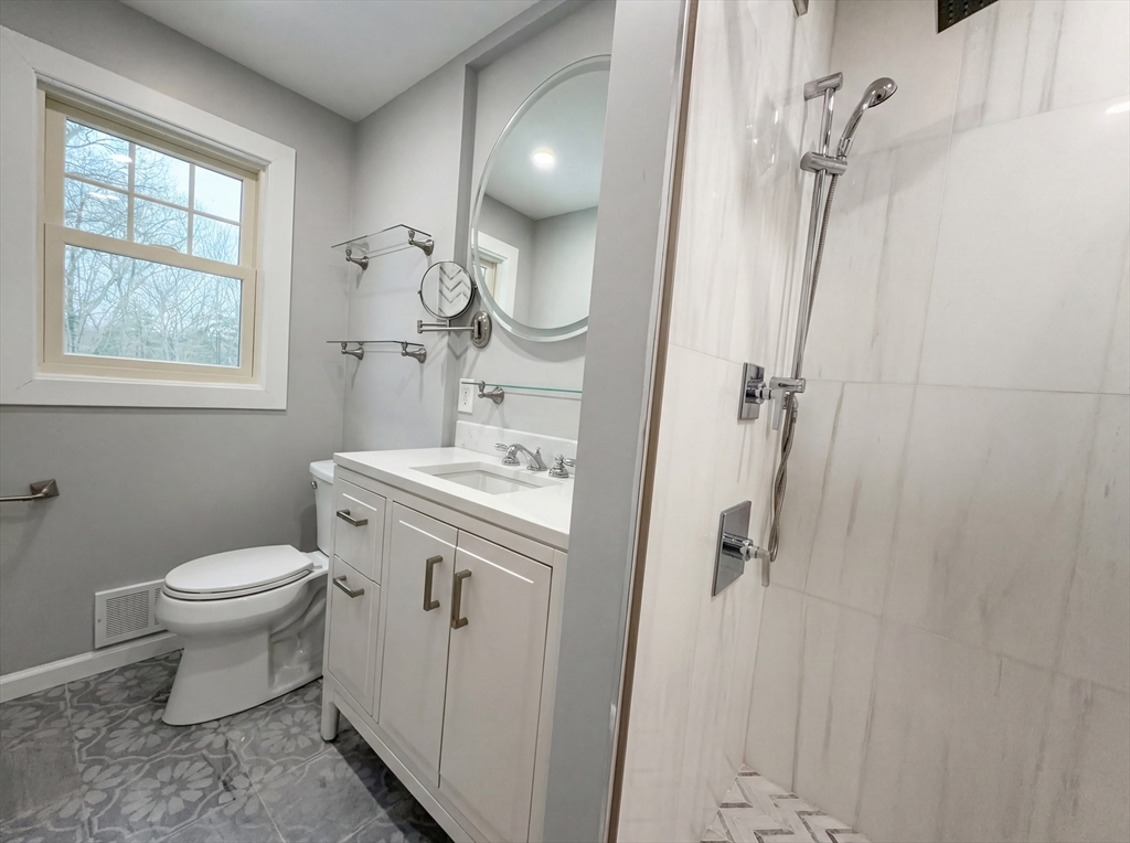 16 Crest Drive Dover, MA 02030 - Photo 16 of 24 a bathroom with a sink toilet and shower