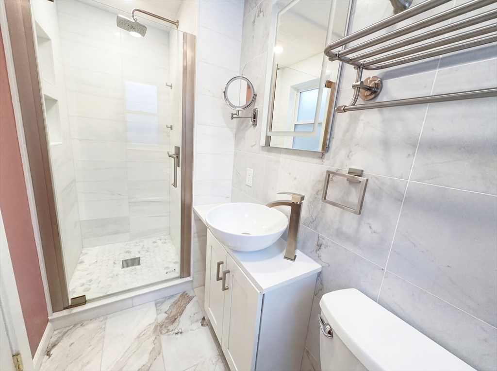 16 Crest Drive Dover, MA 02030 - Photo 18 of 24 a bathroom with a sink a toilet a mirror and shower