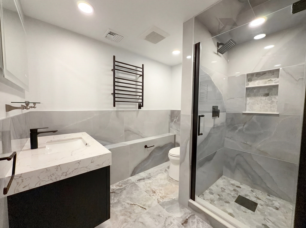 16 Crest Drive Dover, MA 02030 - Photo 21 of 24 a bathroom with a sink a toilet and mirror