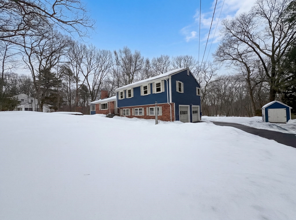16 Crest Drive Dover, MA 02030 - Photo 22 of 24 a view of a house with a snow in a yard