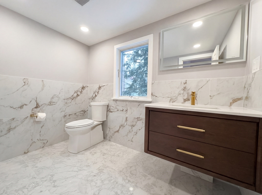16 Crest Drive Dover, MA 02030 - Photo 8 of 24 a bathroom with a toilet sink and mirror