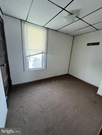 a view of a room that has a window in it