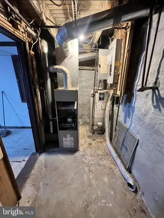 a view of walk in closet with clothes