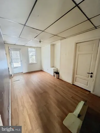 a view of livingroom with hardwood floor and hallway