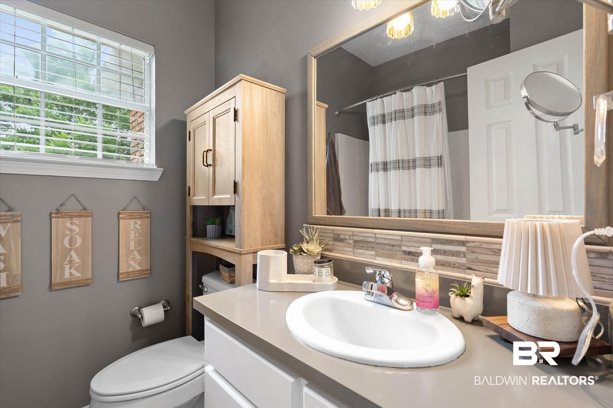 3170 Scott Dairy Loop Road West Mobile, AL 36695 - Photo 15 of 24 Bathroom featuring a single vanity with an oval basin, a gray countertop, and white cabinetry
