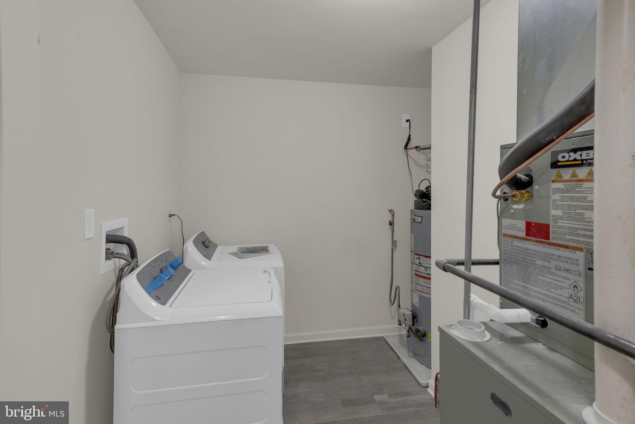 36 Apache Court Absecon, NJ 08205 - Photo 13 of 39 Modern laundry space with sleek appliances.