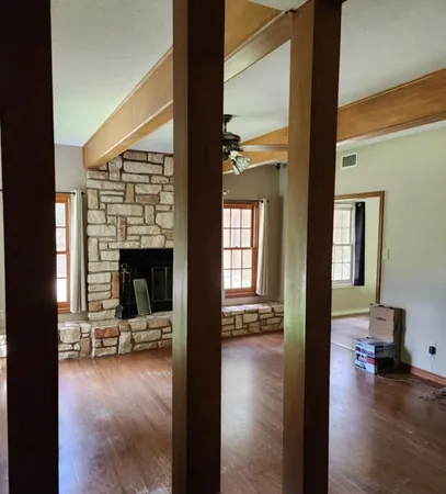 a view of a livingroom with furniture and a fireplace