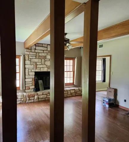 a view of a livingroom with furniture and a fireplace