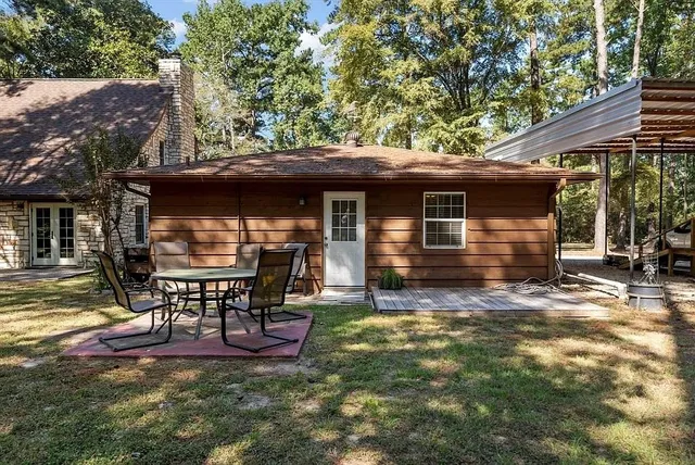 a backyard of a house with seating space