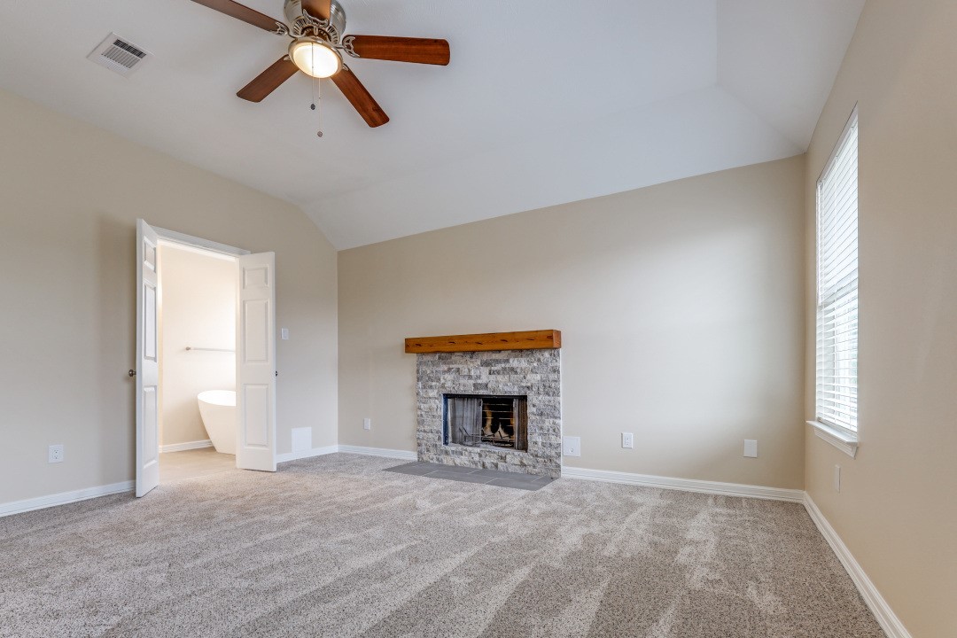 3231 Alabama Street Houston, TX 77004 - Photo 11 of 20 an empty room with a fireplace and window