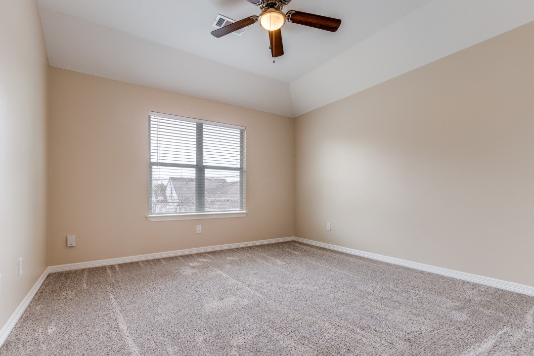 3231 Alabama Street Houston, TX 77004 - Photo 16 of 20 an empty room with a window and a fan