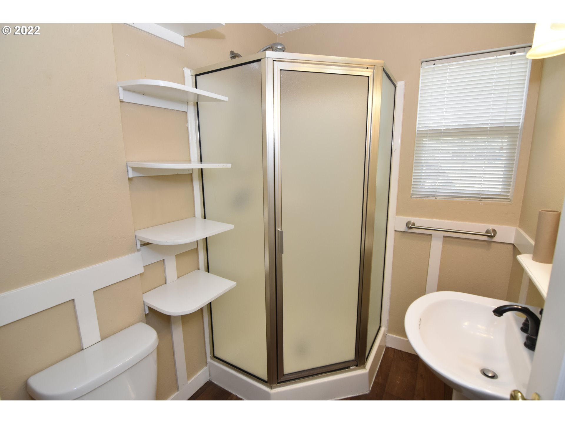 474 Broadway Street Springfield, OR 97477 - Photo 14 of 21 a bathroom with a toilet sink a mirror and vanity