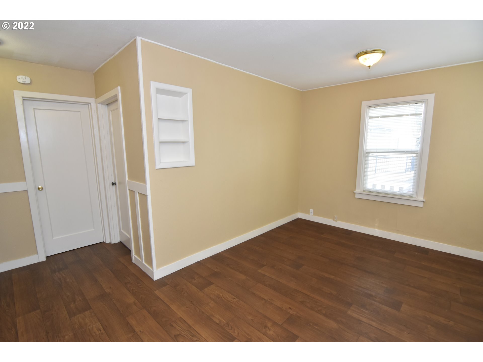 474 Broadway Street Springfield, OR 97477 - Photo 9 of 21 a view of an empty room with wooden floor