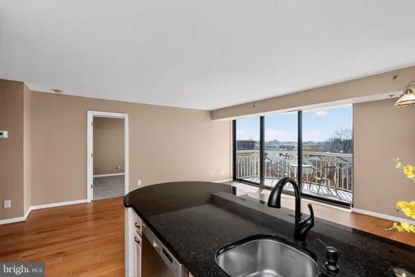 a living room with furniture window and wooden floor