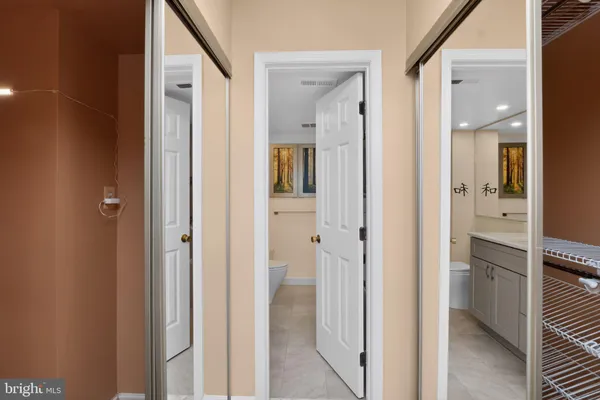 a view of a bathroom from a hallway