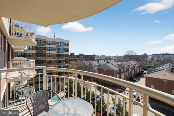 a view of a brick house with many windows