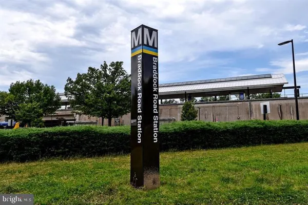 a swimming pool view with a outdoor seating