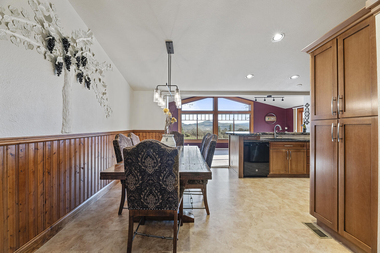 1052 Holcomb Springs Road Gold Hill, OR 97525 - Photo 40 of 65 Dining Area with Vineyard Views and Open Kitchen Access