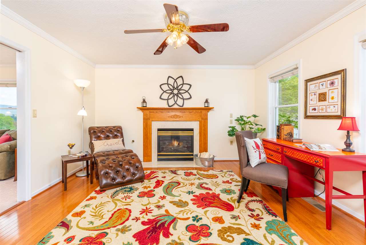 66 Cedar Ridge Road Waynesboro, VA 22980 - Photo 12 of 48 a living room with furniture and a fireplace