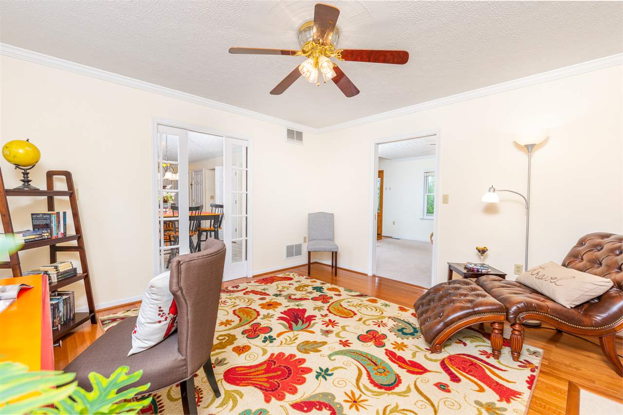 66 Cedar Ridge Road Waynesboro, VA 22980 - Photo 13 of 48 a bedroom with a bed and a chandelier